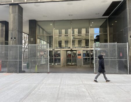 Manhattan Civil Court is shown as a person walks by.
