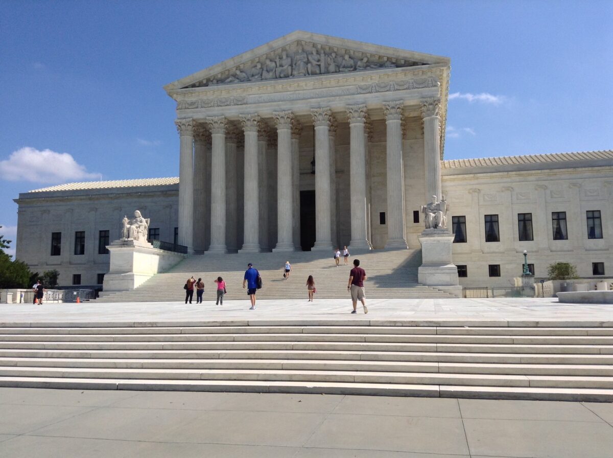 The Supreme Court Building is shown on a sunny day.