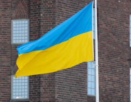 The Ukrainian flag is shown flying.