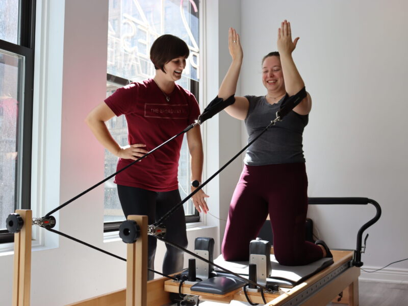 Performing-arts physical therapist Megan Wise assists her patient, Megan Groh, in completing strength and flexibility exercises Sept. 19. Wise primarily works with dancers, theater performers and backstage workers like Groh, a Broadway wardrober. (Credit: Sarah Komar)