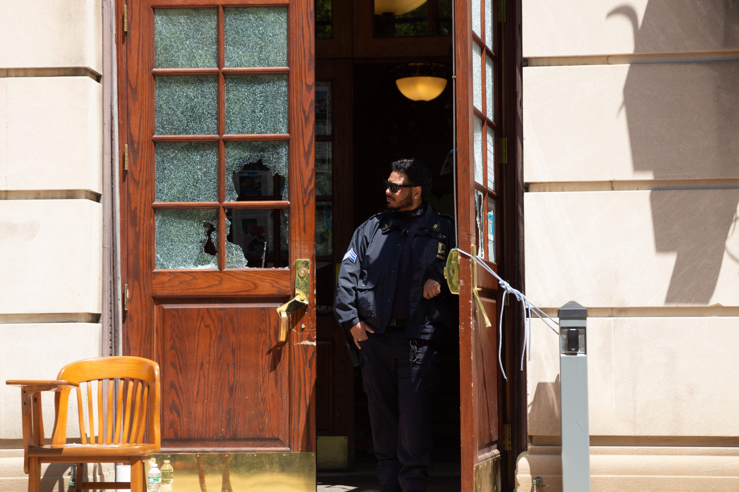 Image taken on May 1, 2024 a day after police raided the protests at Columbia University a public safety officer stands in the doorway of Hamilton Hall. (Credit: Indy Scholtens)