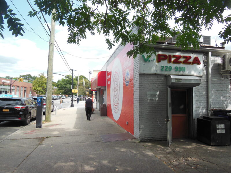 A customer walks into V.I. Pizza in Bayside, Queens (Credit: Jake Angelo).