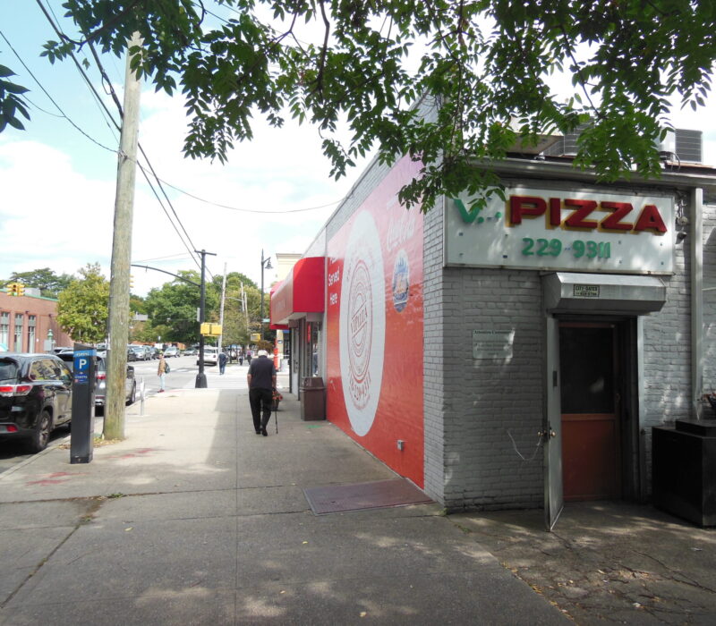 A customer walks into V.I. Pizza in Bayside, Queens (Credit: Jake Angelo).