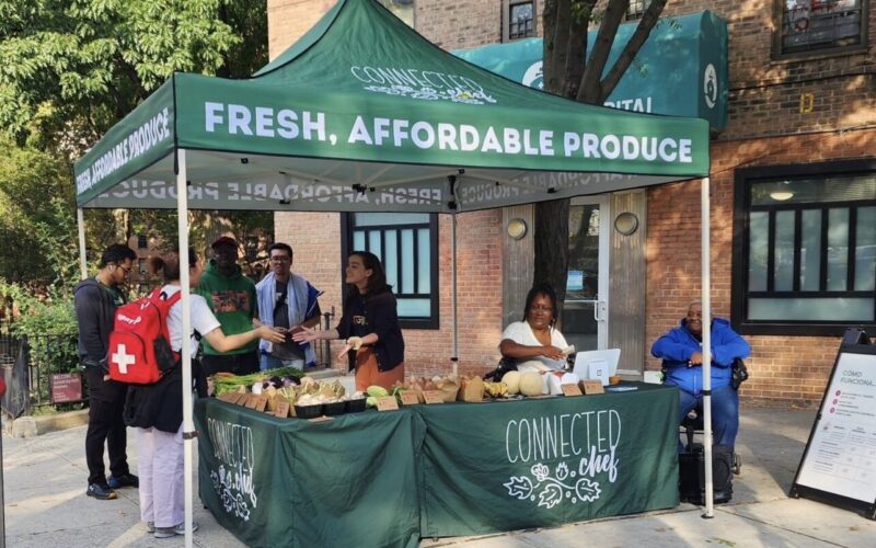 Local students volunteer to give out food from Connected Chef in Queensbridge on October 3, 2024. (Courtesy image: Lashawn Marston)