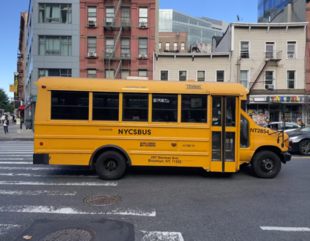 At the end of the school day, yellow buses make their way down Dr Martin Luther King Jr Boulevard in Harlem. (Credit: Béatrice Vallières)