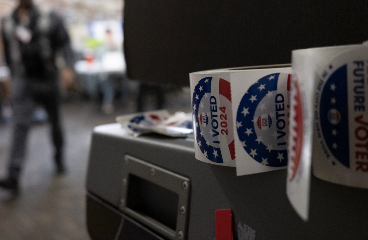 ‘I Voted’ stickers line the ballot scanning machines at a polling station at JCC Harlem on Election Day. (Credit: Megha Gupta)