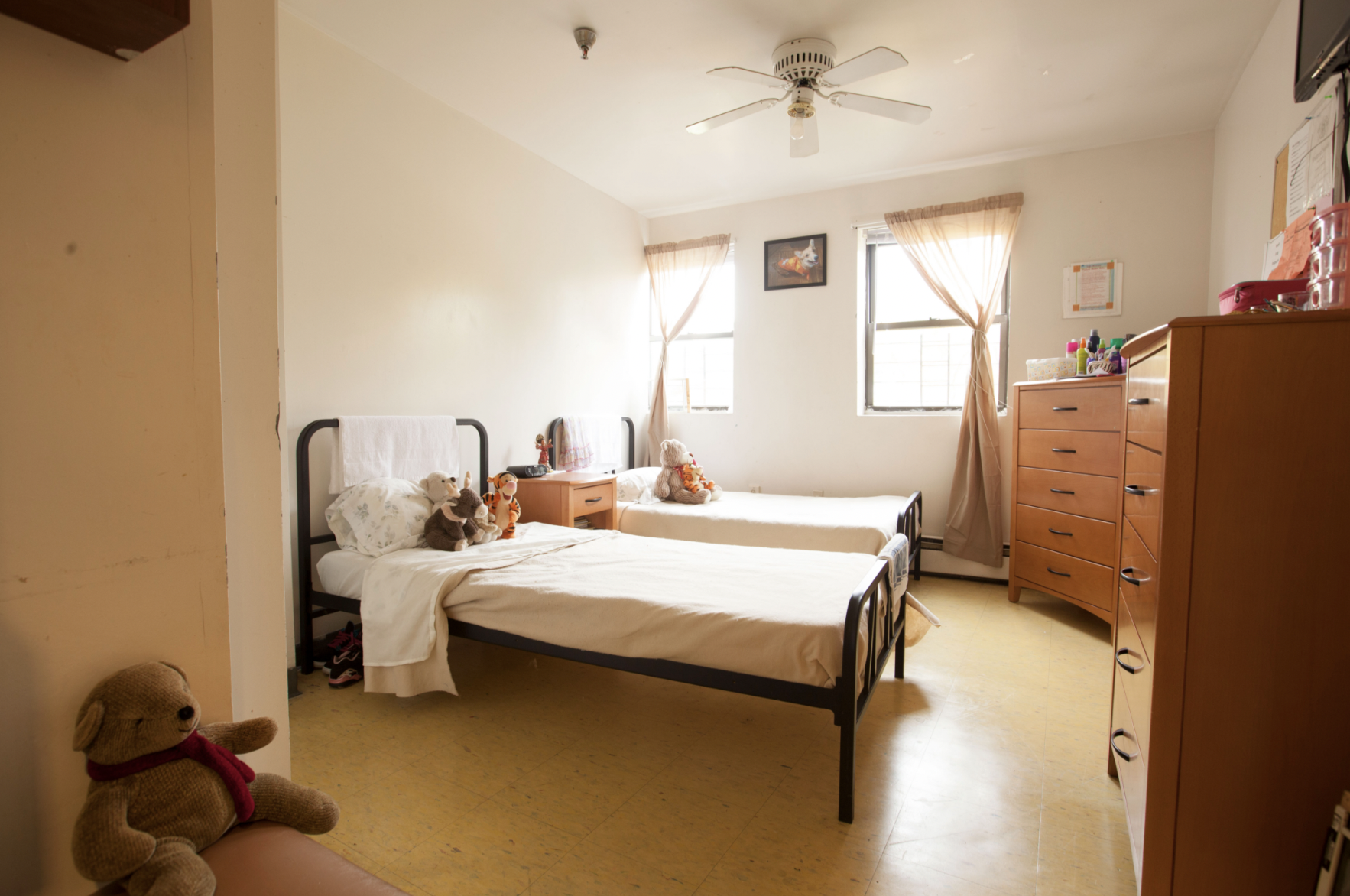 A domestic violence shelter room with two beds. (Courtesy: Safe Horizon)