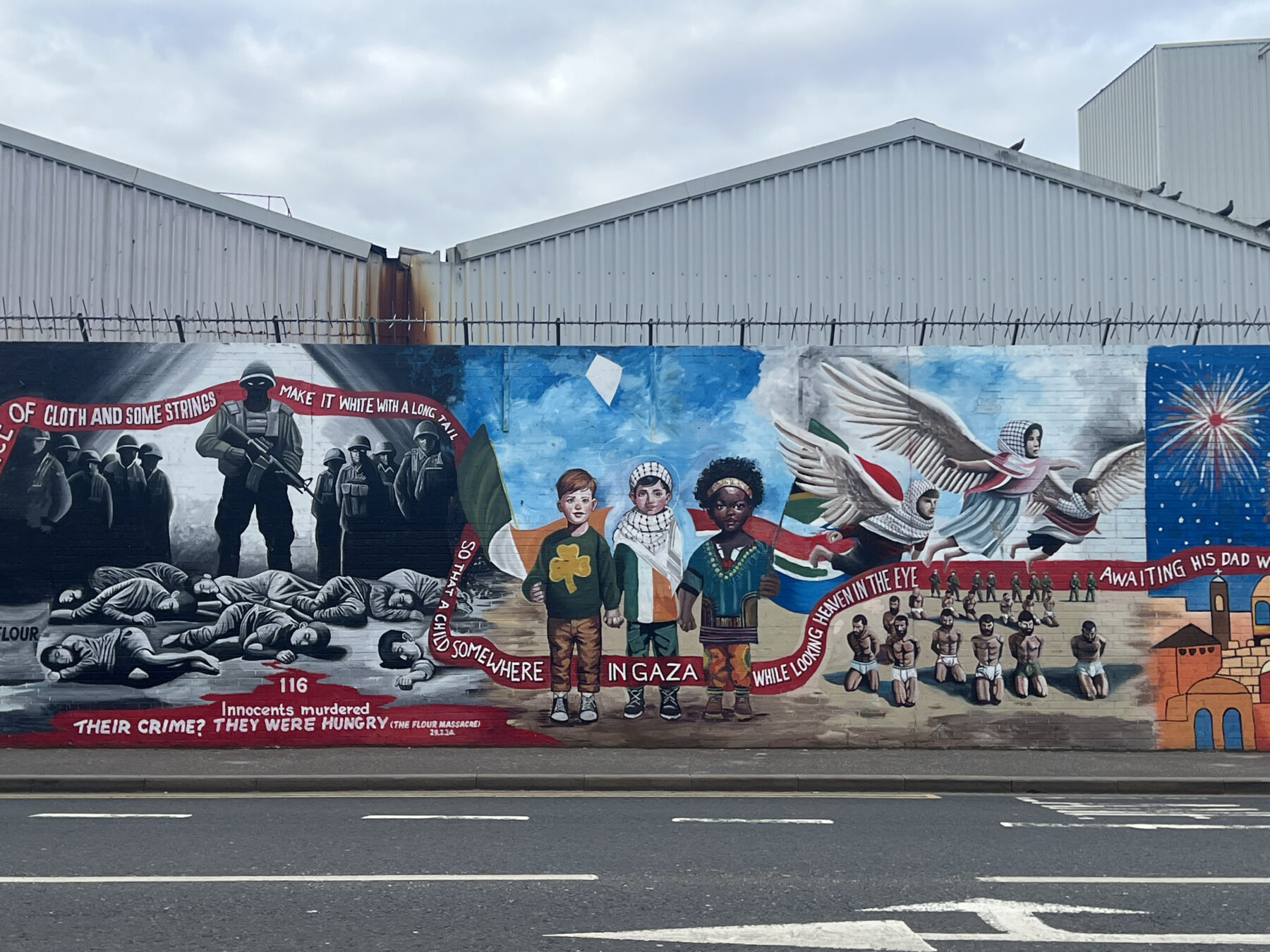 Palestinian solidarity murals cover the International Wall in West Belfast (Credit: Abbie Hopson)