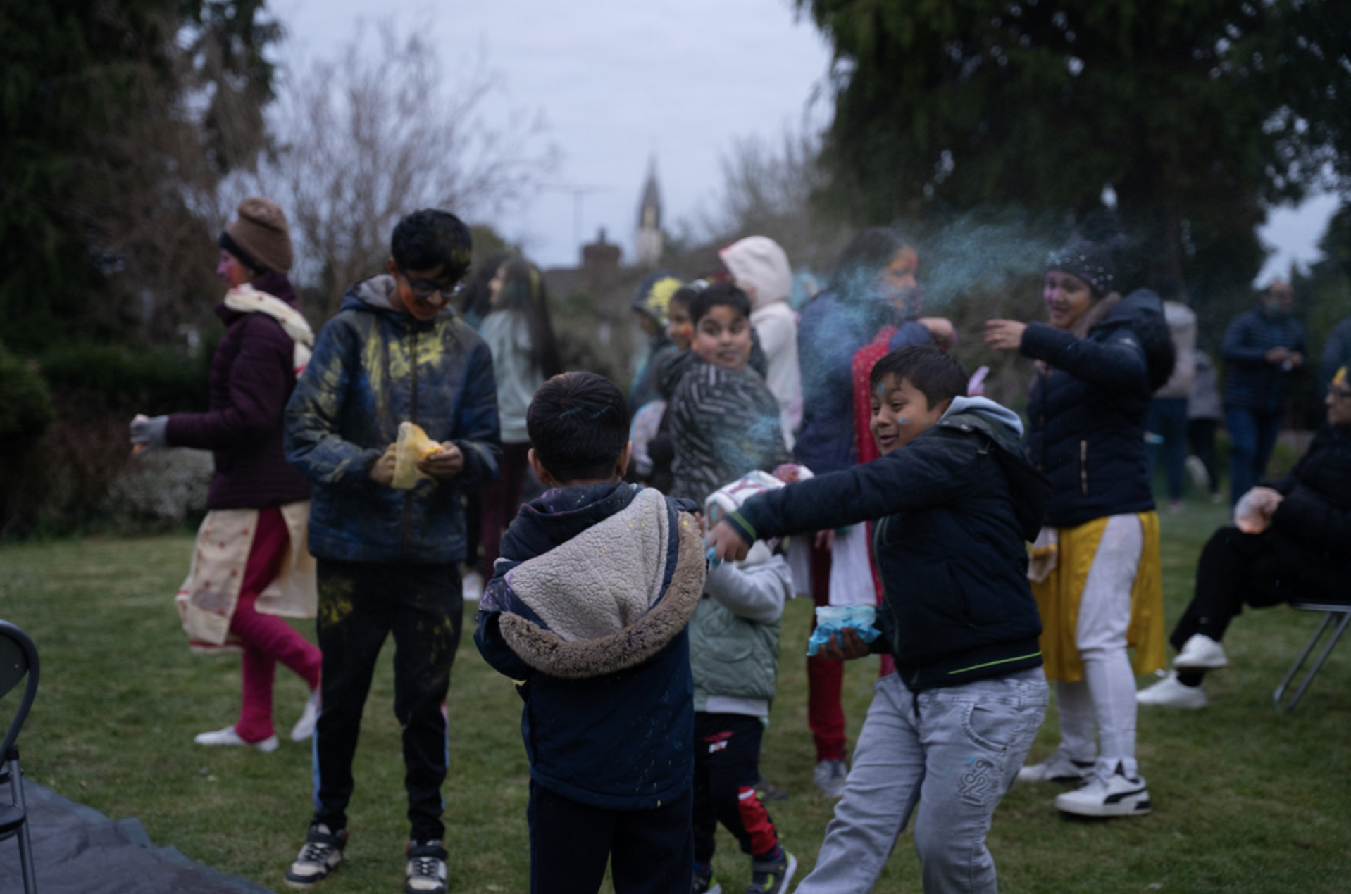 Children throw color at each other at the Holi celebration held by ISKCON Belfast on March 16. (Credit:Laine Immell)
