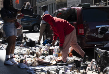 A street vendor lays out goods on Broadway in Manhattan, Sep. 20, 2025. (Credit: David Pinto)