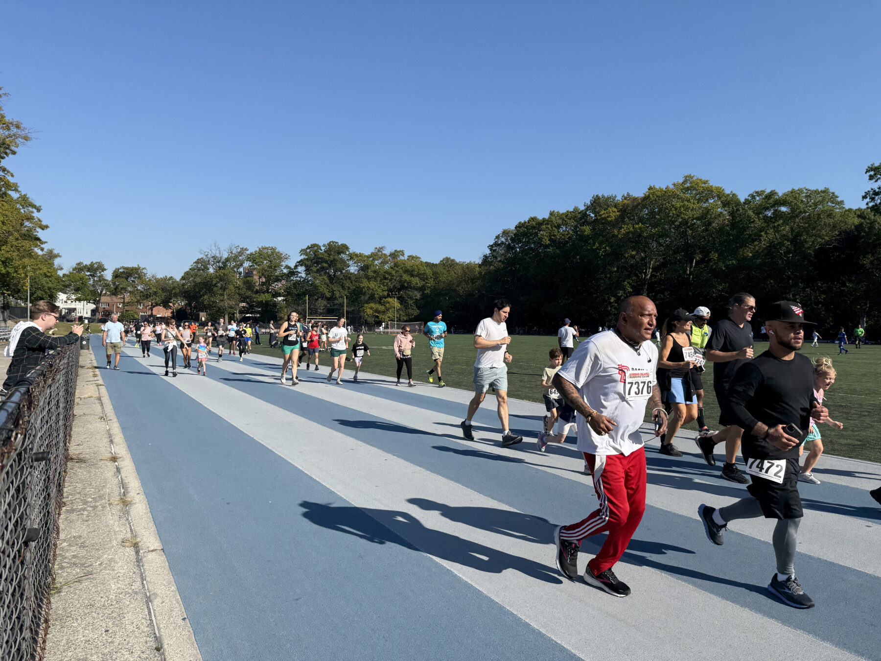 Those who opted for the 1-mile run complete two laps around the track. (Credit Kat Struhar)