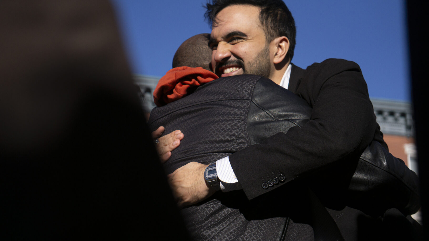 Mayoral candidate Zohran Mamdani hugs a supporter outside a polling site at PS 20 Anna Silver School in the Lower East Side of New York on Election Day, Tuesday, Nov. 4, 2025. (Credit: Rachel Zhong)