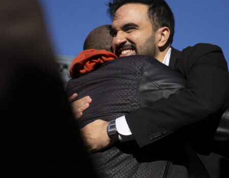 Mayoral candidate Zohran Mamdani hugs a supporter outside a polling site at PS 20 Anna Silver School in the Lower East Side of New York on Election Day, Tuesday, Nov. 4, 2025. (Credit: Rachel Zhong)