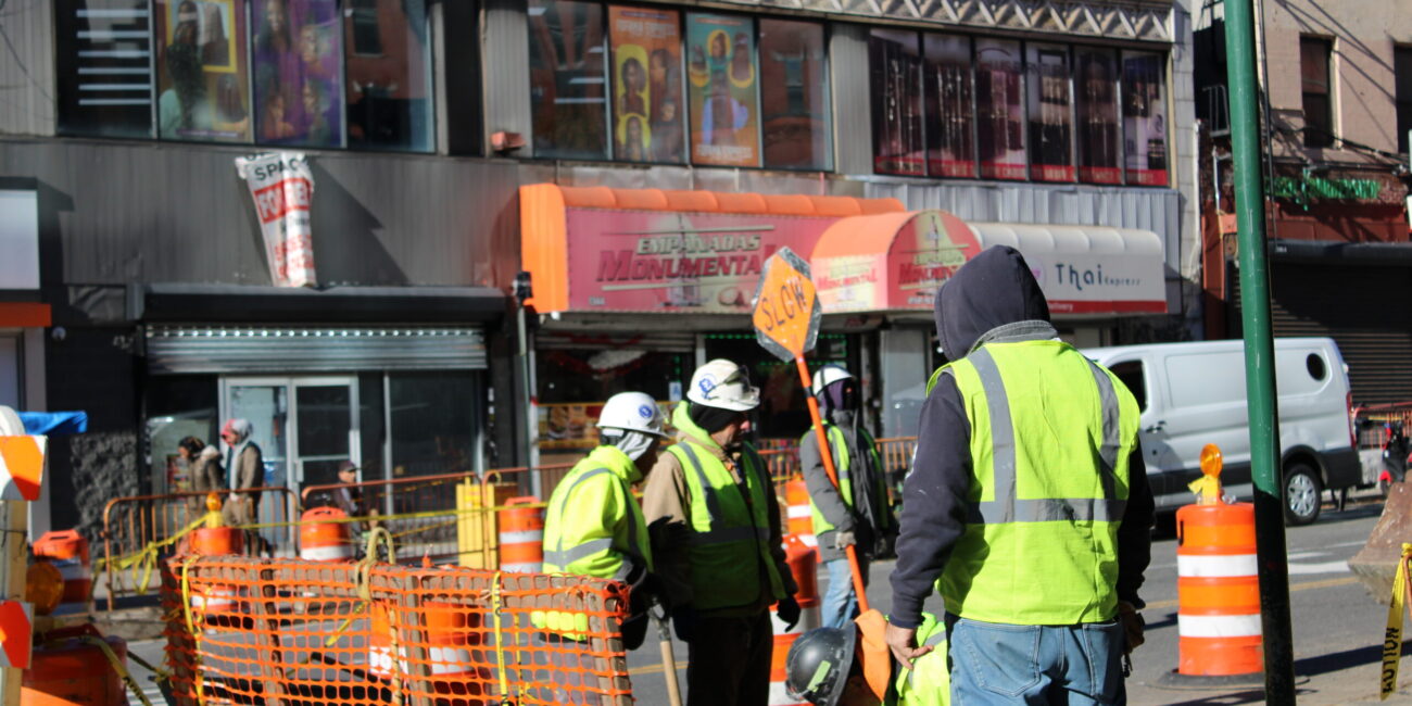 Construction workers operate equipment at a work site in Manhattan. (Credit: Anna Lee)