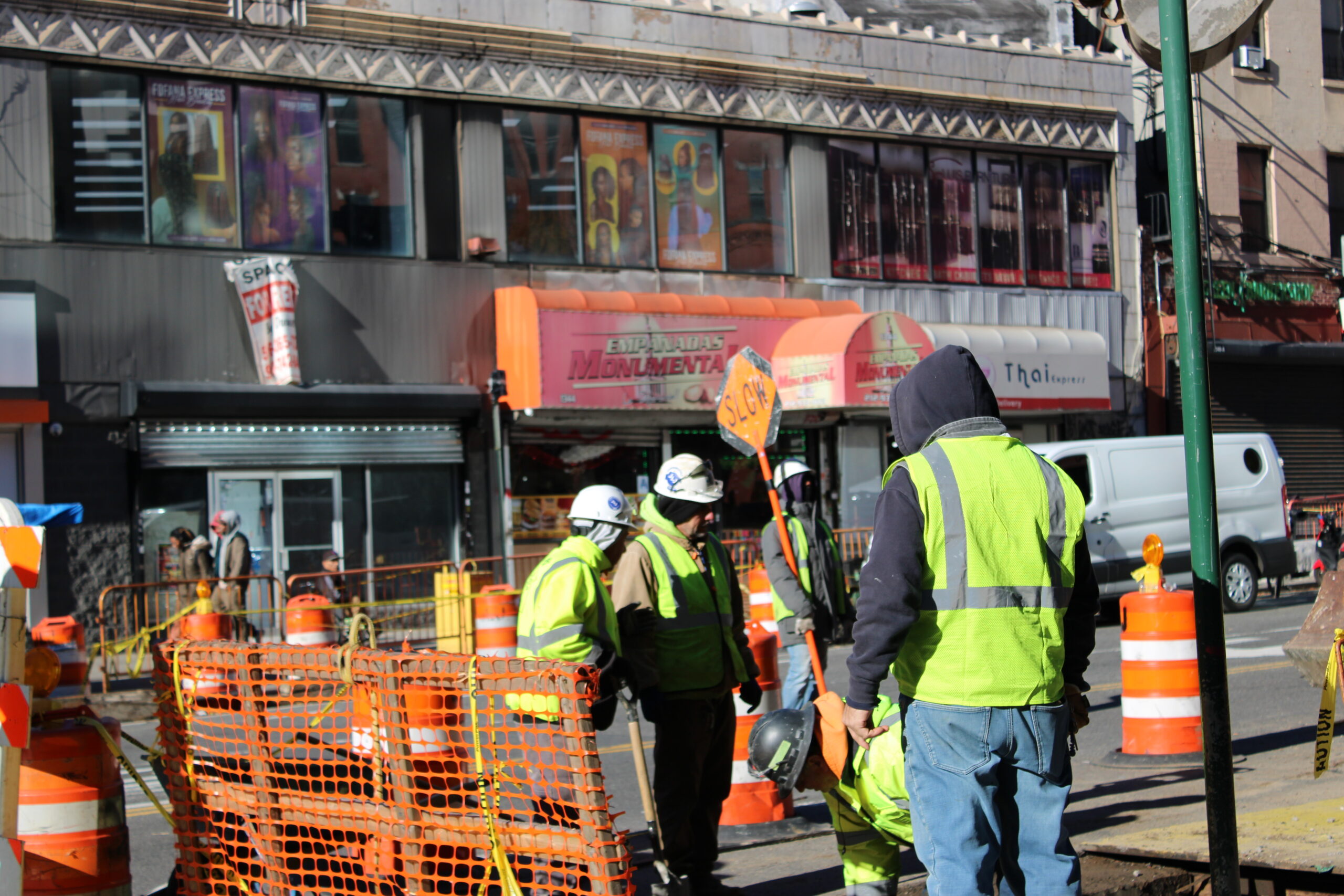 Construction workers operate equipment at a work site in Manhattan. (Credit: Anna Lee)