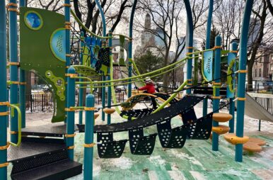 A child plays on Cuyler Gore's new jungle gym. (Credit: Lauren Gabrielle Harris)