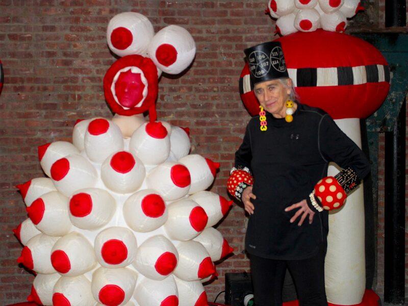 Pat Oleszko poses beside one other inflatable sculptures at the SculptureCenter in Queens (Credit: Anna Lee)