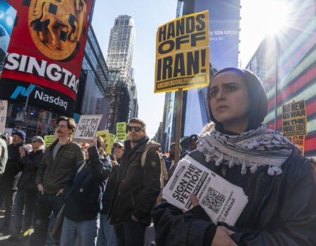 A female protester displayed a concerned expression. (Credit: Victor Heller)