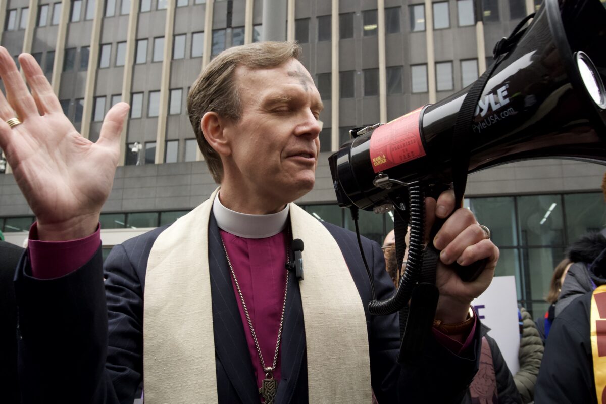 Episcopal Bishop of New York Matthew F. Heyd during a call to prayer at 26 Federal Plaza. (Credit: Sidney Kuri Poor)
