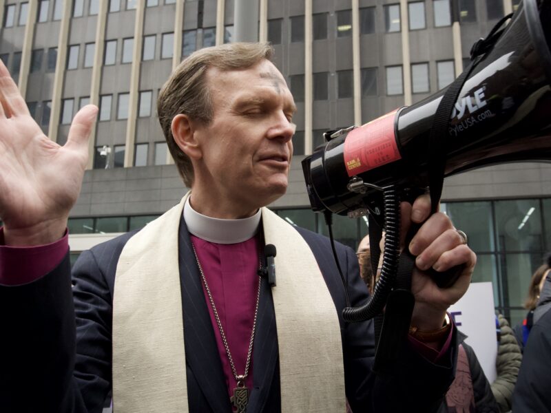 Episcopal Bishop of New York Matthew F. Heyd during a call to prayer at 26 Federal Plaza. (Credit: Sidney Kuri Poor)
