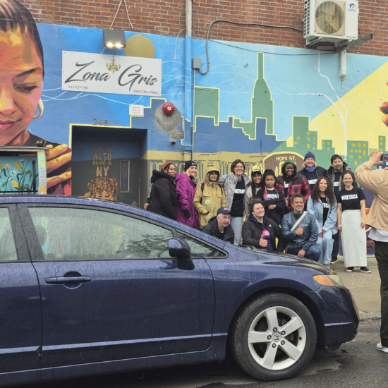 Volunteers from Mixteca Organization, Inc., and Brooklyn Org pose for a photo in Sunset Park after their weekly market offering free produce to Brooklyn's Latino community. (Credit: Sophia Ramirez)