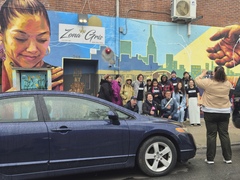 Volunteers from Mixteca Organization, Inc., and Brooklyn Org pose for a photo in Sunset Park after their weekly market offering free produce to Brooklyn's Latino community. (Credit: Sophia Ramirez)