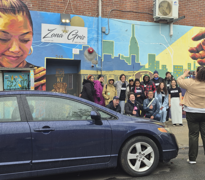 Volunteers from Mixteca Organization, Inc., and Brooklyn Org pose for a photo in Sunset Park after their weekly market offering free produce to Brooklyn's Latino community. (Credit: Sophia Ramirez)