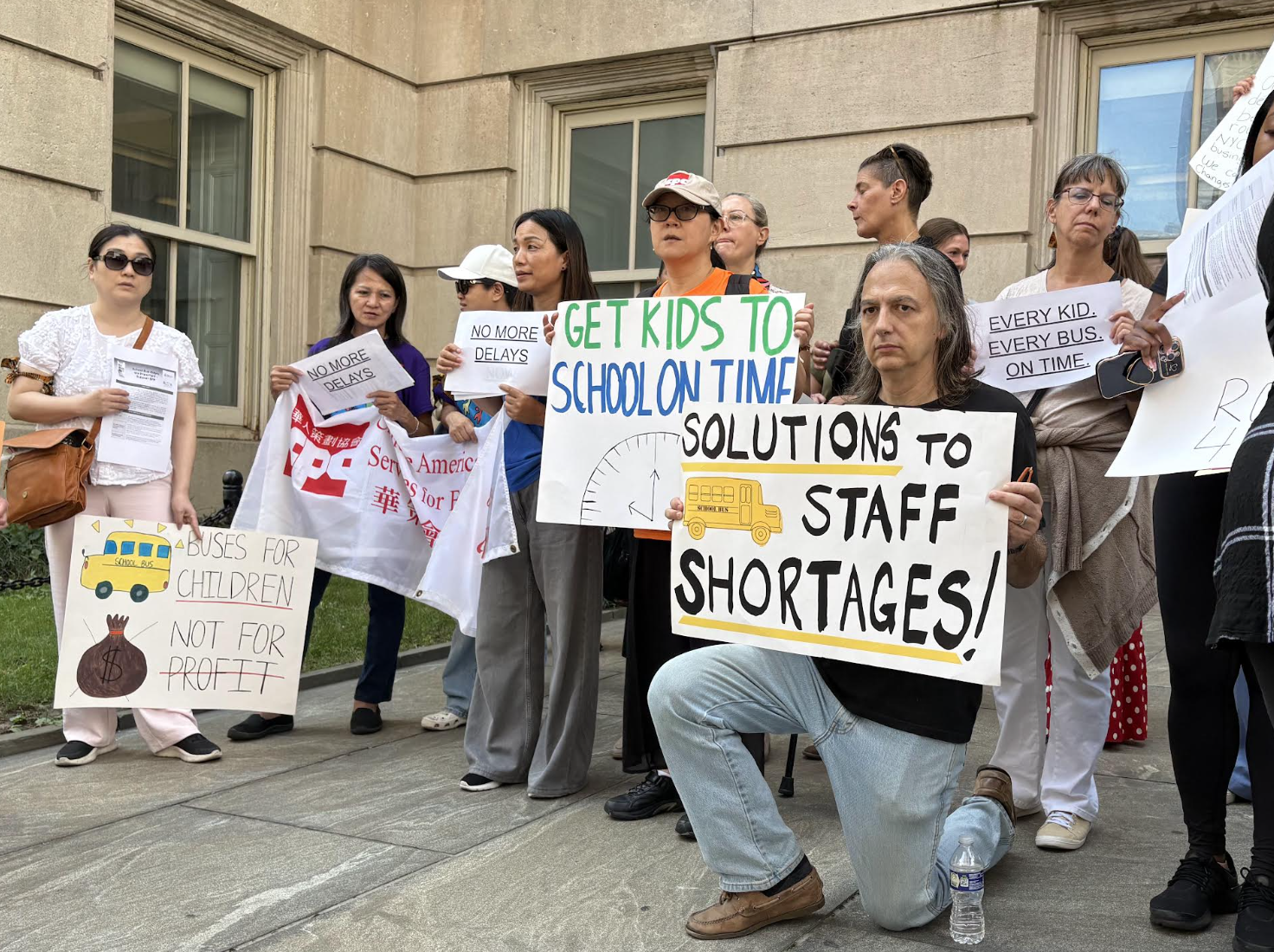 Three dozen parents and advocates call for better school transportation outside Tweed Courthouse on Thursday, Sept. 17. (Credit: Theo Scheer)