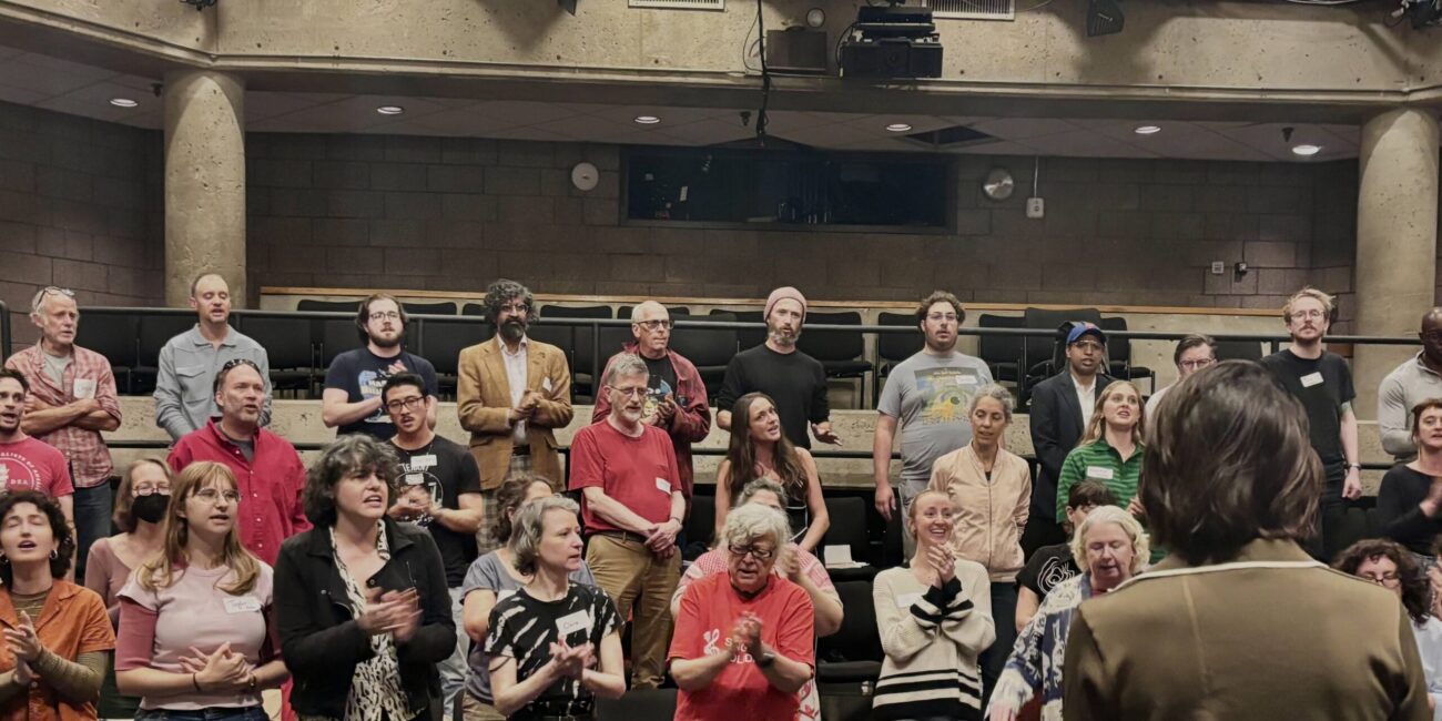 The Sing in Solidarity choir performing “When the Saints Go Marching In”, September 2026. (Credit: Sarah Moran)