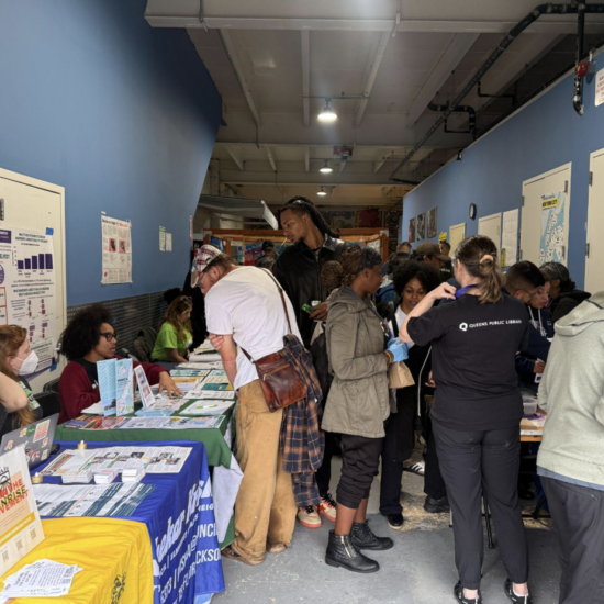 Attendees gather around tables at Street Works Earth at Connected Chef in Woodside on Sept. 27, 2026. The annual climate and arts festival moved indoors after forecasts of a nor’easter forced organizers to abandon plans to hold the event on the 34th Avenue Open Street in Jackson Heights. (Credit: Daniel Rivero Alvarez)