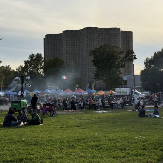 The Queens Night Market sits behind the New York Hall of Science in Flushing Meadow Corona Park. Thousands of people pour in and out every week enjoying food from nearly 100 different countries. (Credit: Karla Perez)
