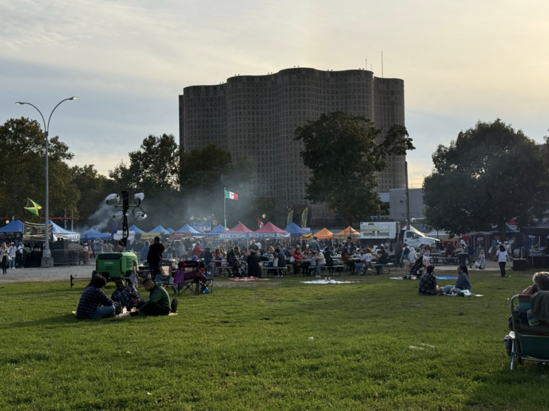 The Queens Night Market sits behind the New York Hall of Science in Flushing Meadow Corona Park. Thousands of people pour in and out every week enjoying food from nearly 100 different countries. (Credit: Karla Perez)