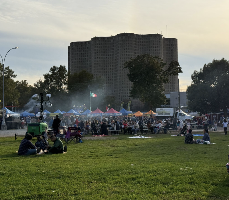 The Queens Night Market sits behind the New York Hall of Science in Flushing Meadow Corona Park. Thousands of people pour in and out every week enjoying food from nearly 100 different countries. (Credit: Karla Perez)