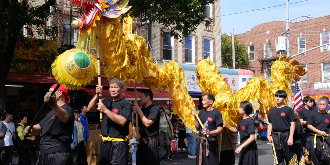The parade featured a dragon dance troupe, shown marching down 8th Avenue. (Credit: Kim Nguyen)