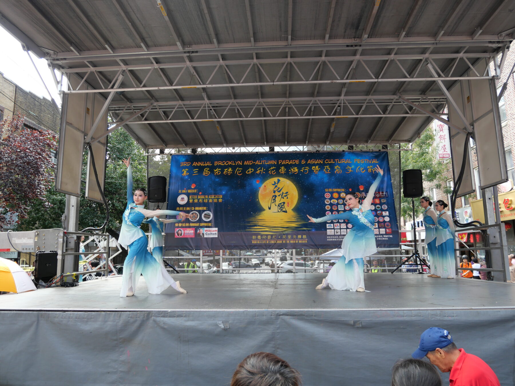 Children perform a folk dance performance on stage. (Credit: Kim Nguyen)